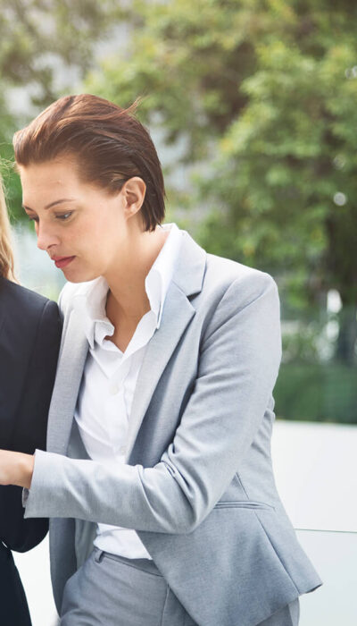 businesswoman-corporate-colleagues-talking-P3PSNFM